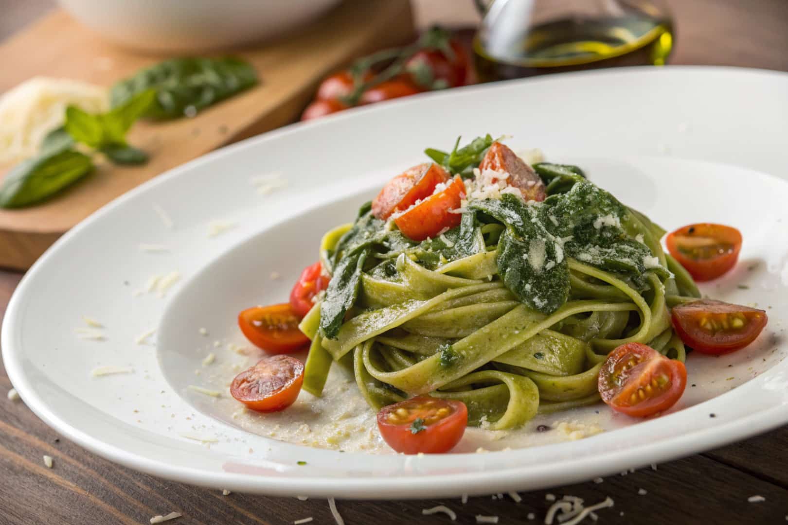 spinach tomato pasta featured dish plated