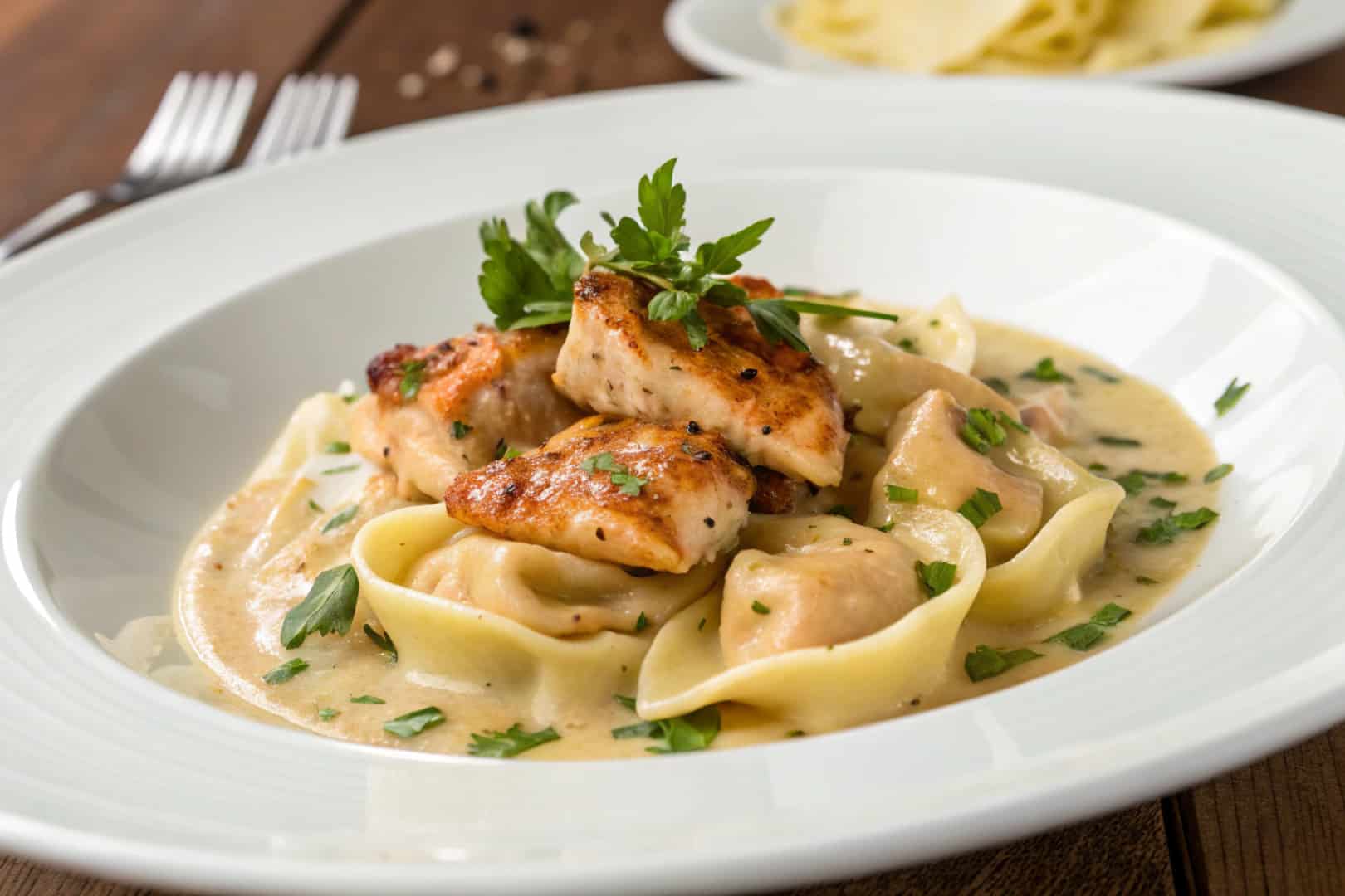 cajun chicken tortellini with garlic sauce featured dish plated
